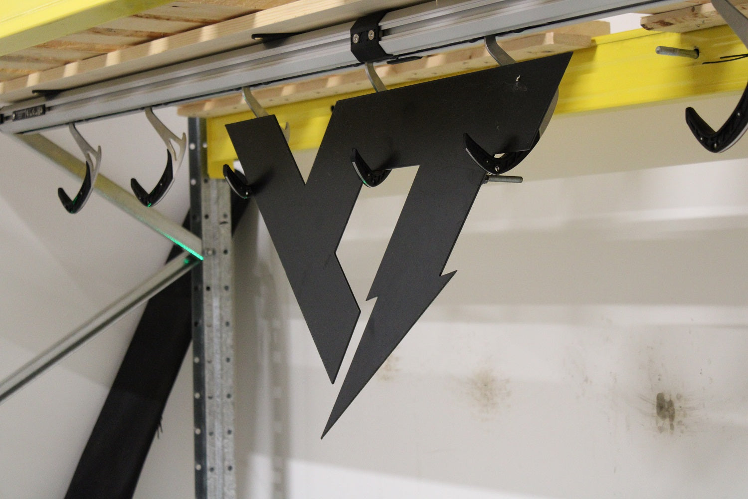 SpaceRail system can hang more than just bikes, like this logo